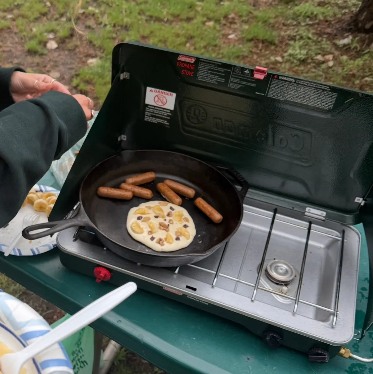 Banana walnut pancakes and sausages in the Lodge skillet on my Coleman 2-burner