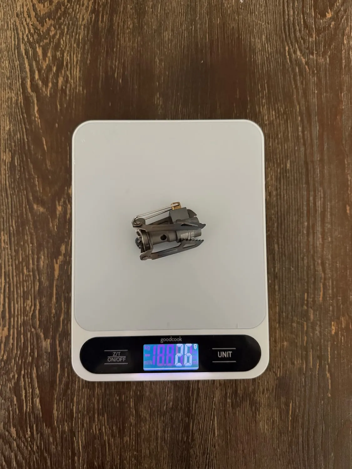The BRS-3000T stove on a kitchen scale reading 26 grams