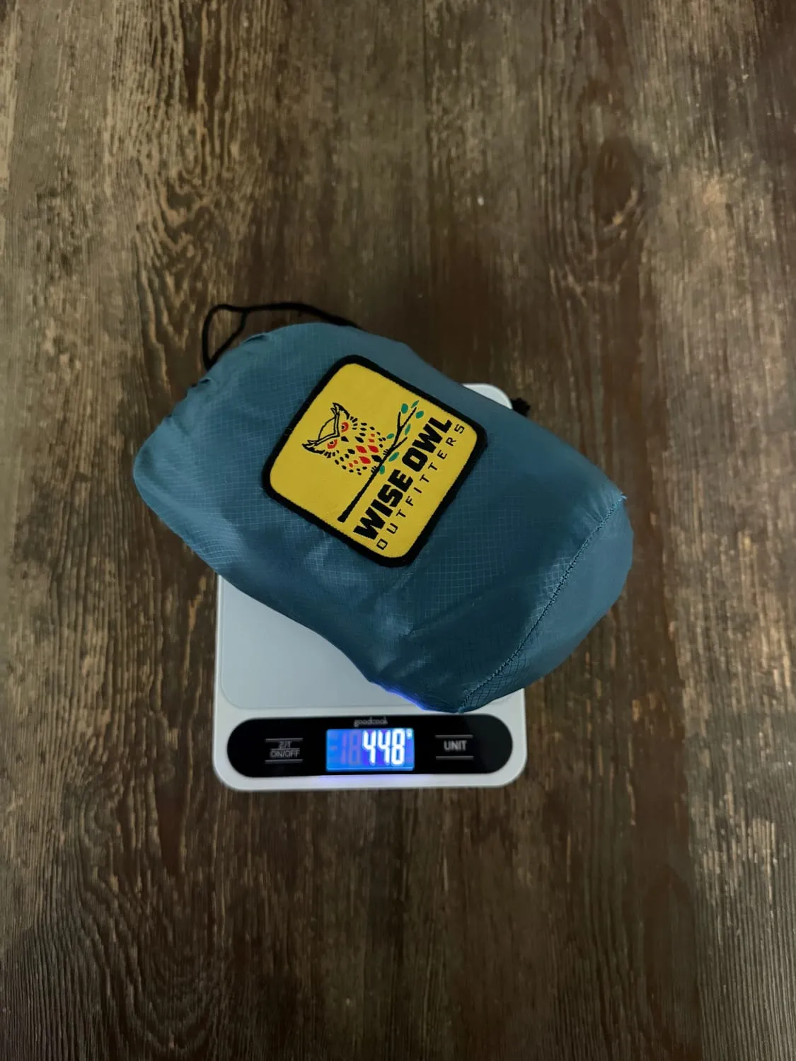 The Wise Owl DoubleOwl hammock in its stuff sack on a kitchen scale