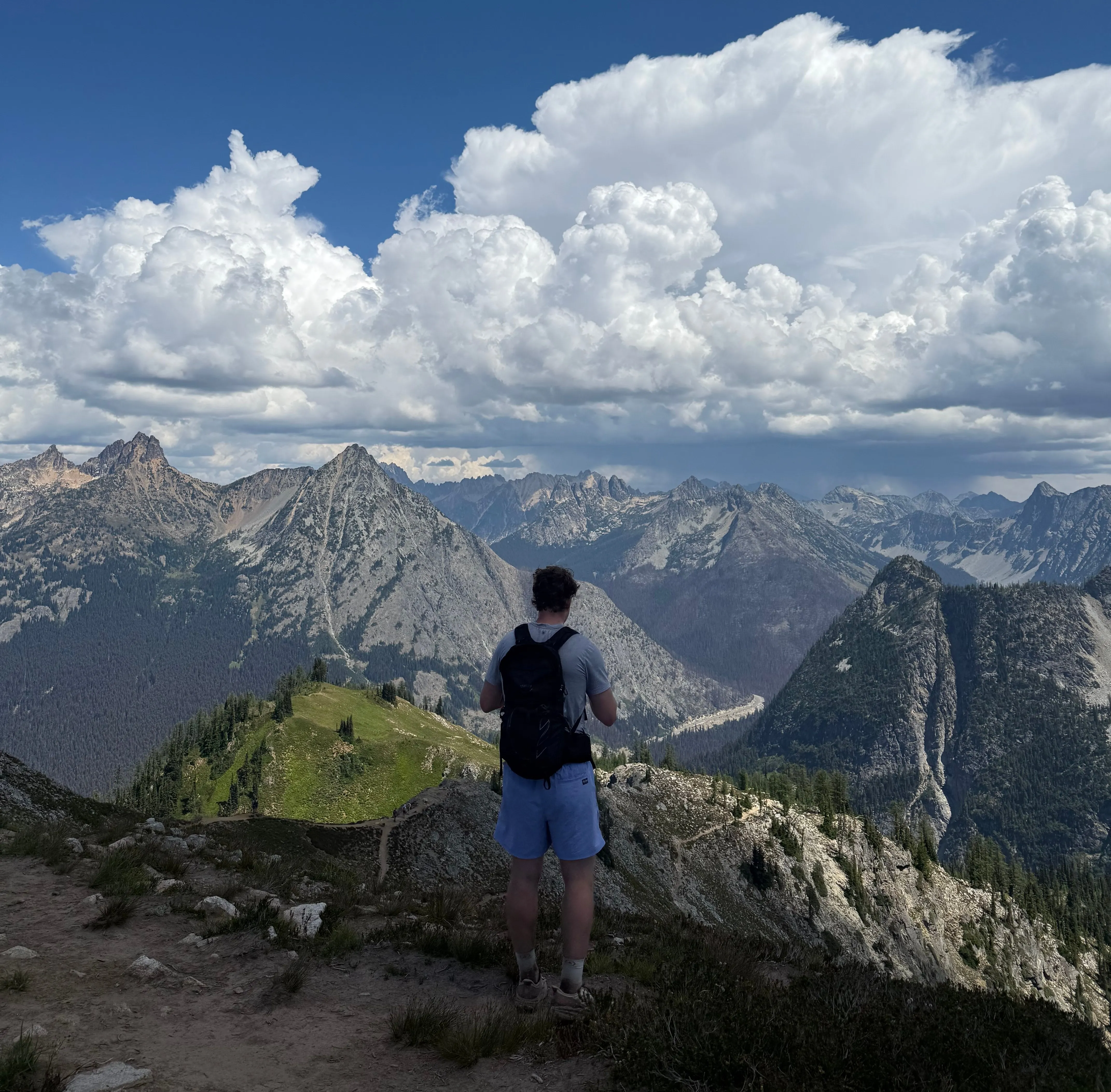 The Talon 26 on a mountain ridgeline with peaks in every direction
